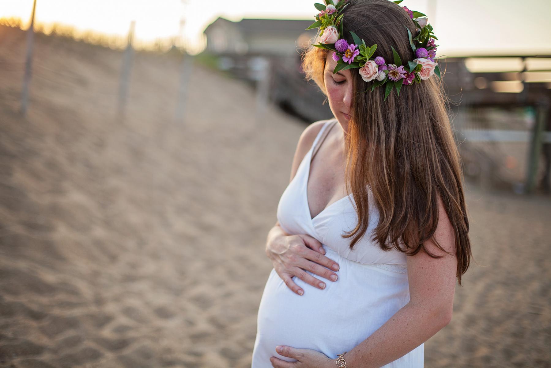 Maternity photo of woman with flower crown in Outer Banks NC