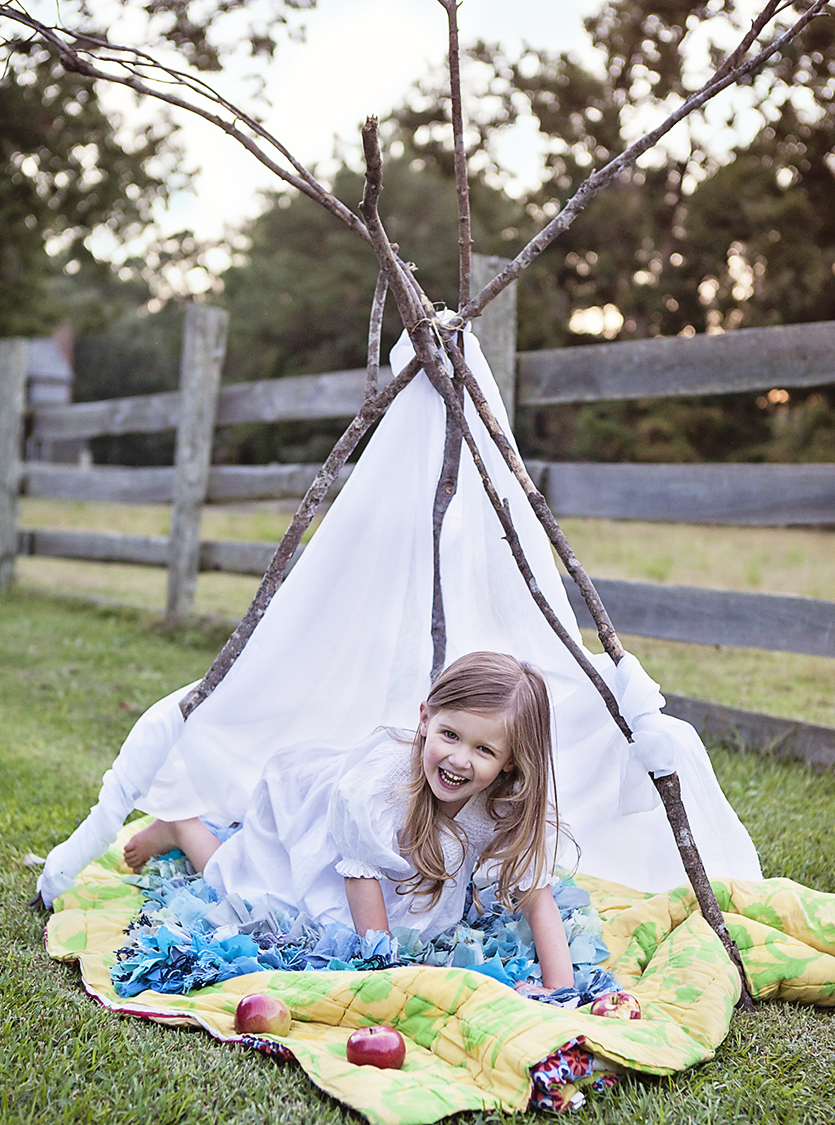 Playing in a teepee at Island Farm in Manteo, NC