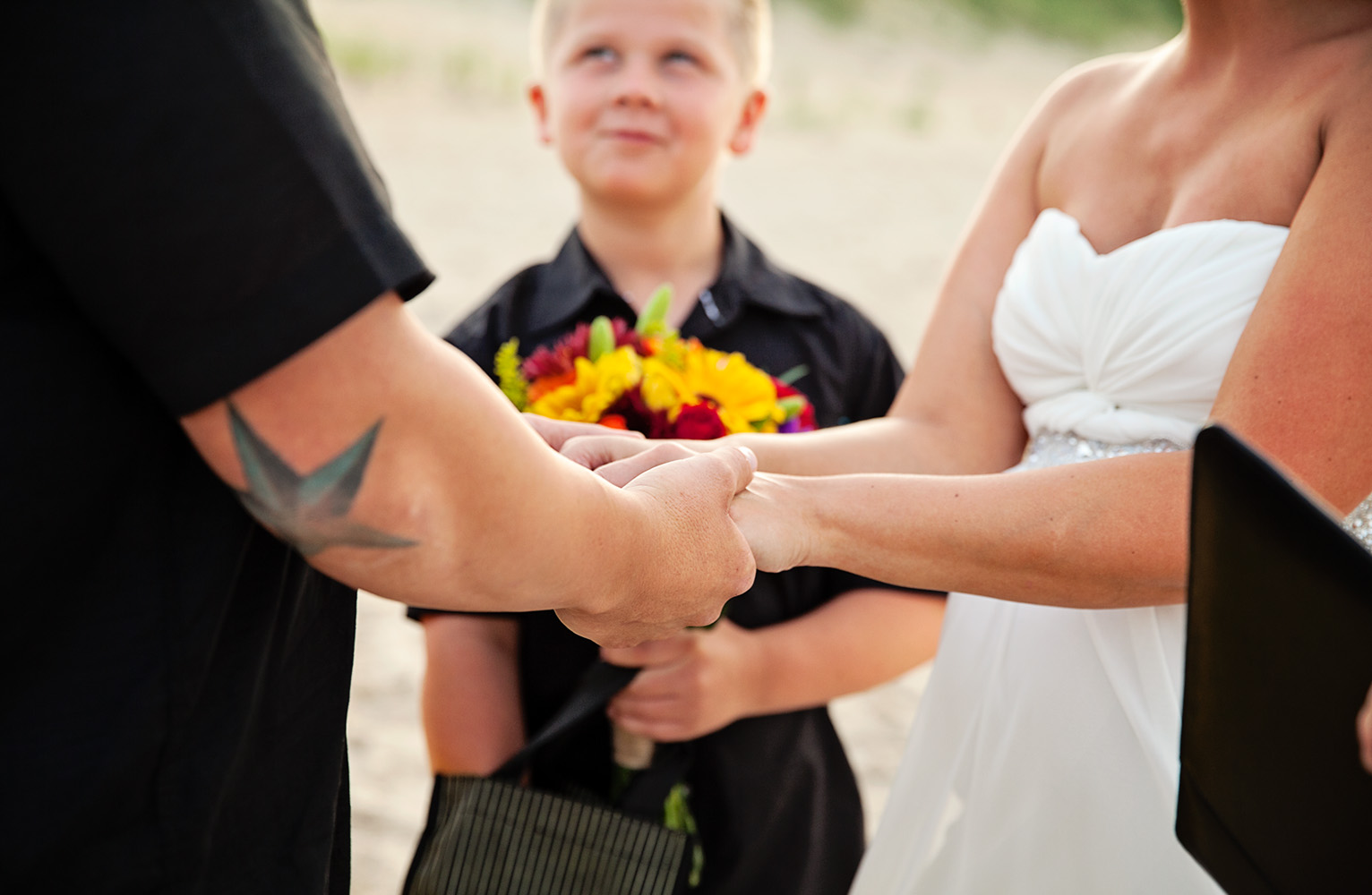 Wedding couple in Nags Head holding hands