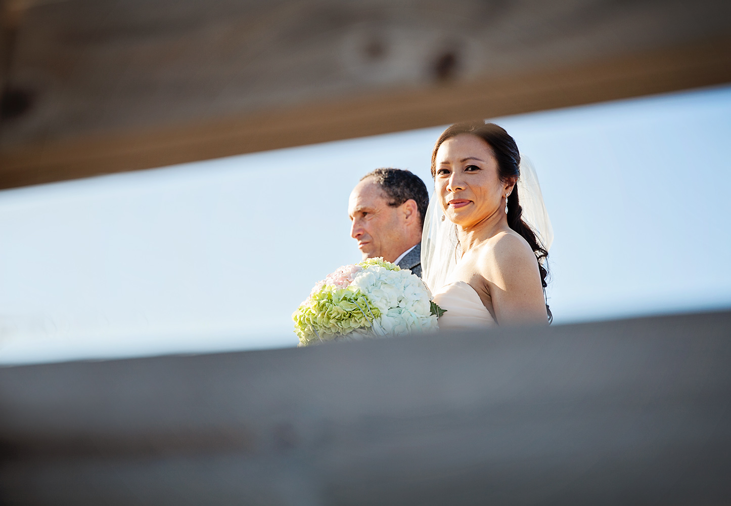 Bride and father walking Jennettes pier