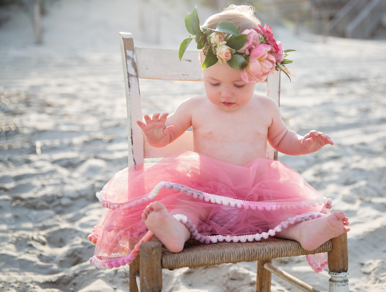 One year old girl photo with tutu and flower crown on beaches of Outer Banks NC