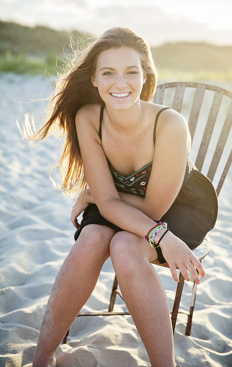 senior high school girl portrait on a chair at the beach in Nags Head, NC