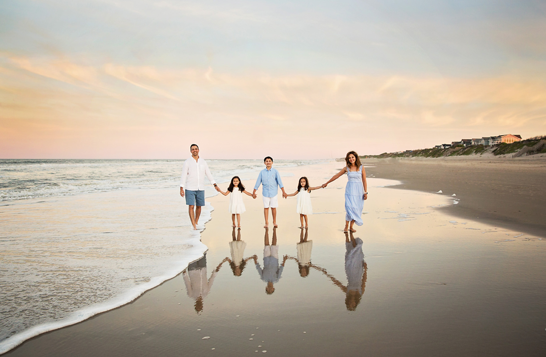 family photo in Corolla with refection in water