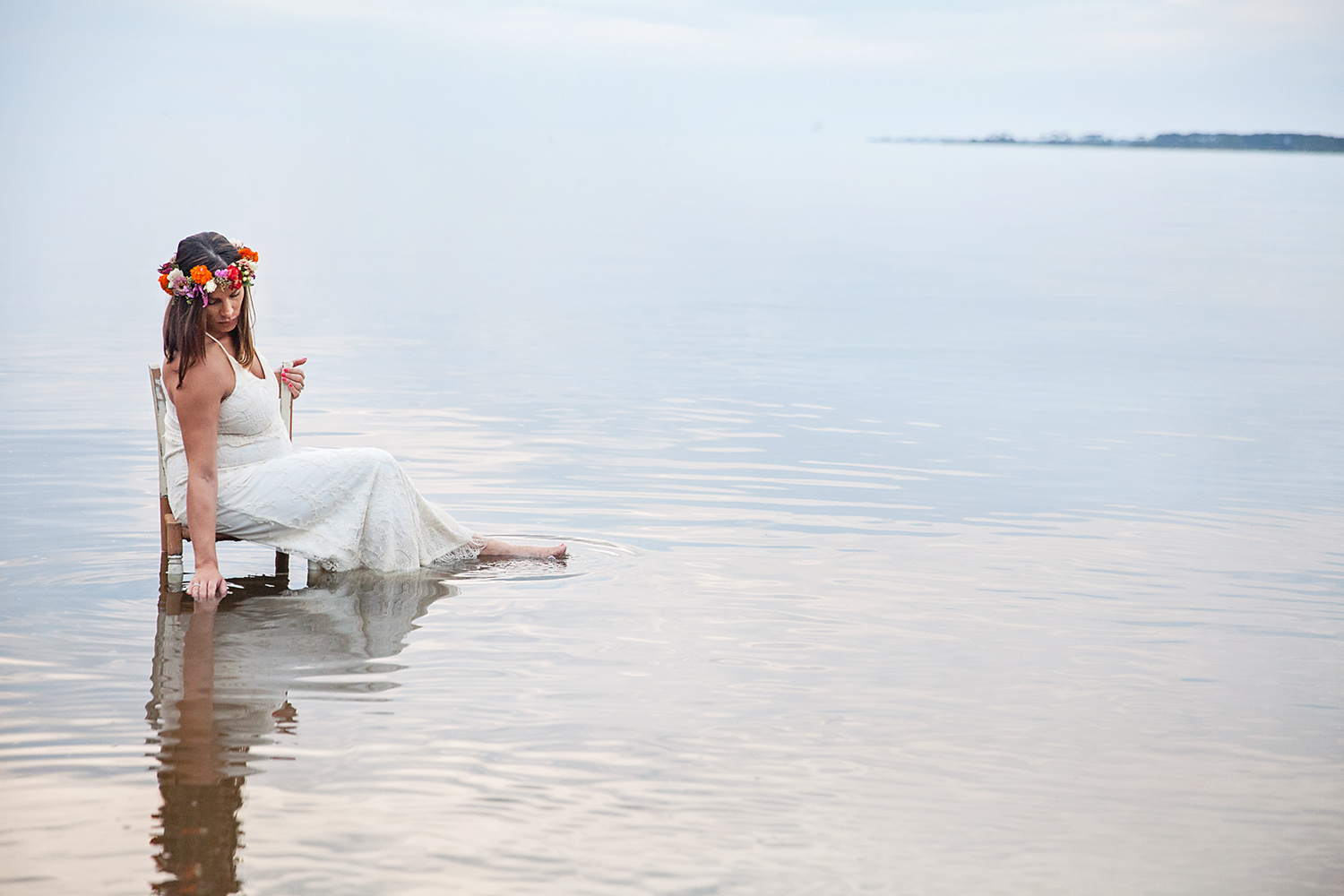 Pregnant woman in water with gorgeous flower crown