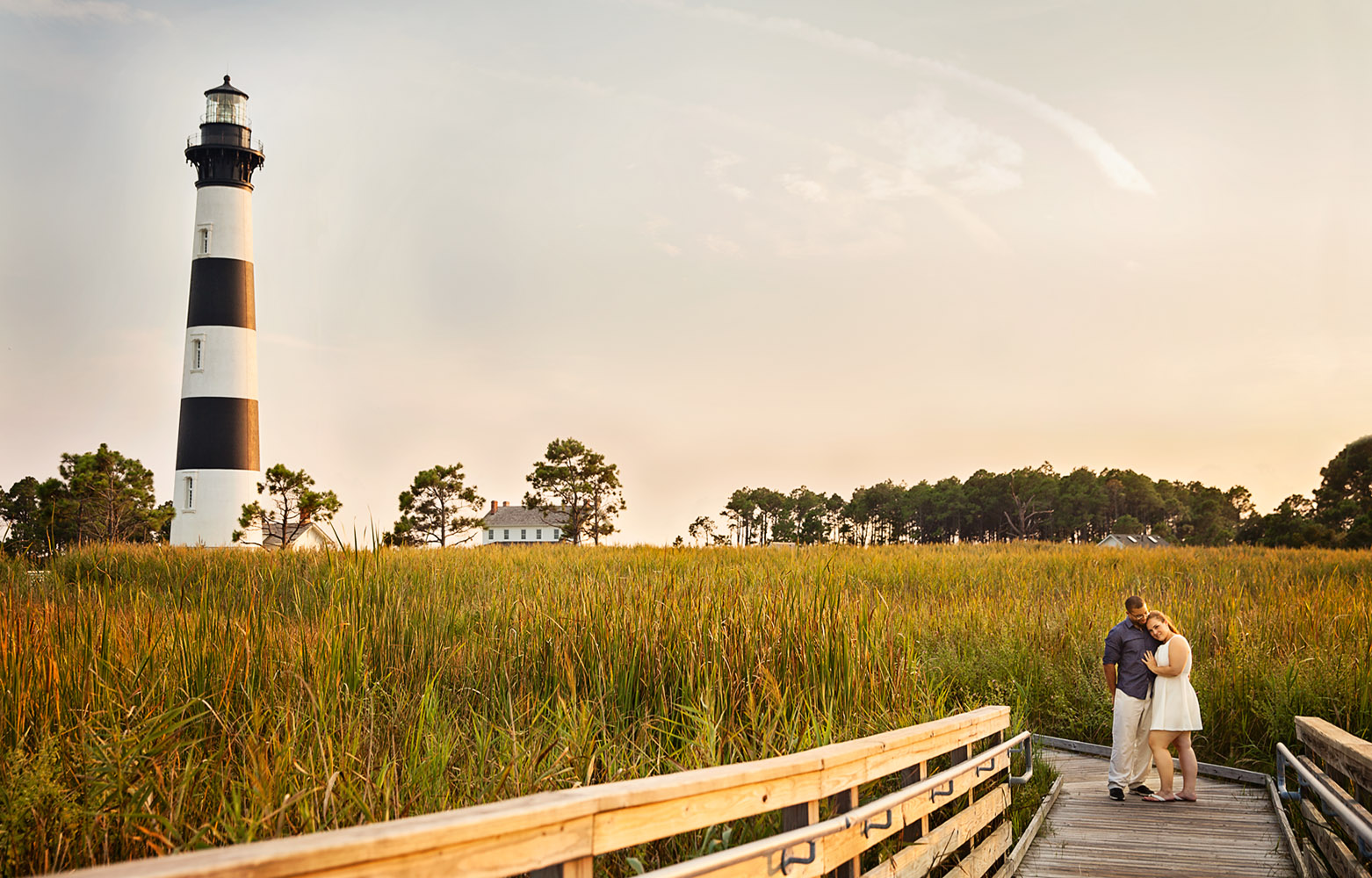 Engaged couple at Bodie Island lighthouse