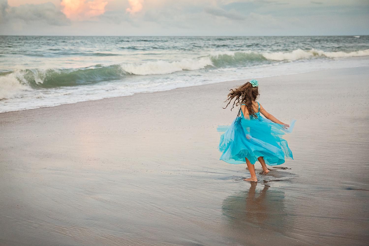 Outer Banks photograph of Little girl twirling photograph in Nags Head NC