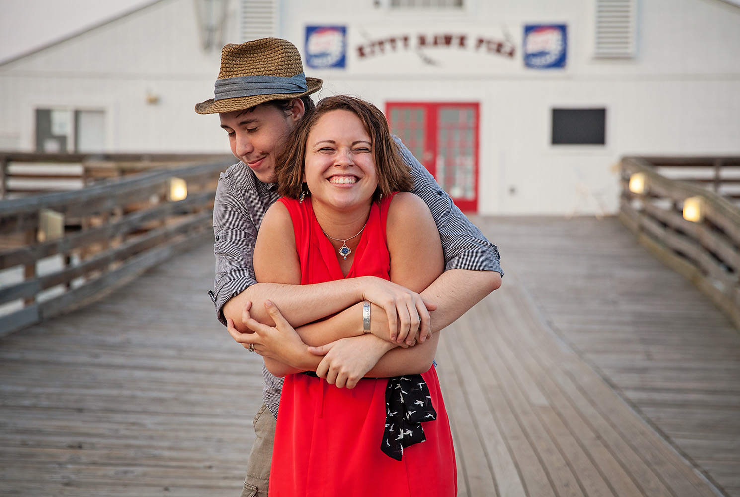 Engaged couple at Kitty Hawk Pier